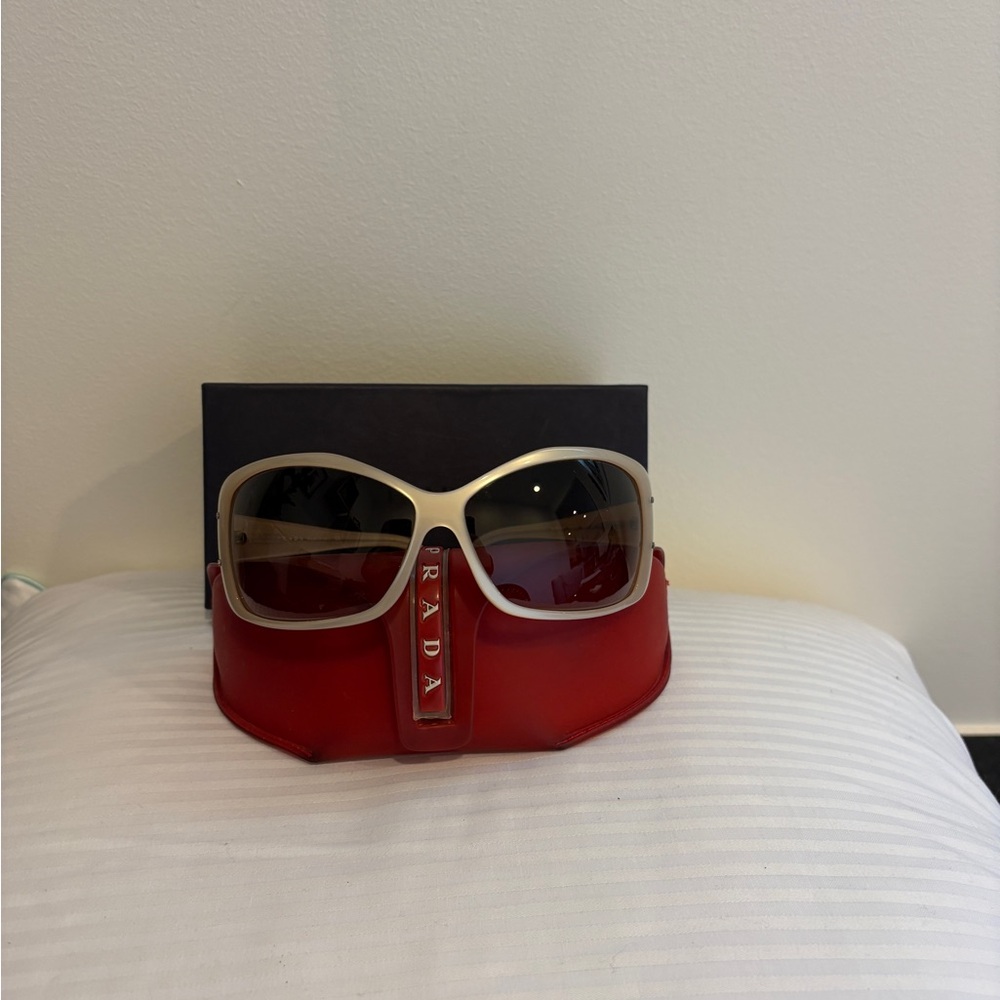 Prada Sunglasses with Beige Frames and Red Case